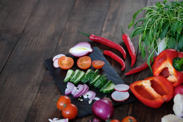 vegetables for salad on an old wooden table. - Foto, Imagen