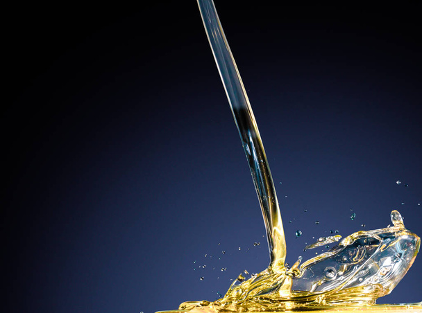Close-up of oil and liquid pouring on dark background. - Фото, зображення