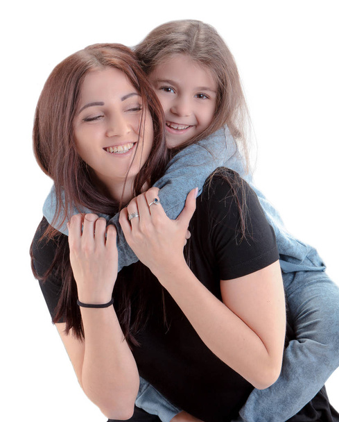 Loving mother and her daughter child girl playing and hugging on white background. Concept of happy. Studio shoot - Zdjęcie, obraz