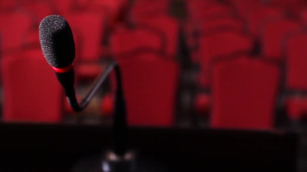 Close up of microphone in conference hall. Scene. Microphone on stage close-up in an empty room - Footage, Video