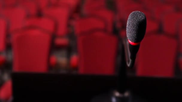 Close up of microphone in conference hall. Scene. Microphone on stage close-up in an empty room - Footage, Video