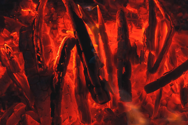 Red hot coal texture in bonfire. Bright background of fire, firewood and charcoal. - Photo, Image