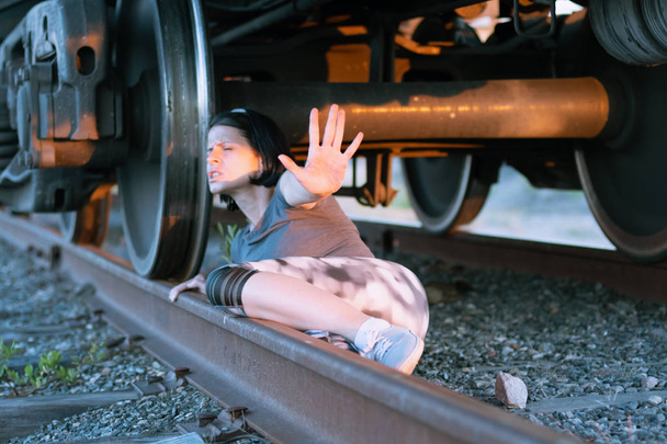 View under the moving train with escaping girl - Photo, Image