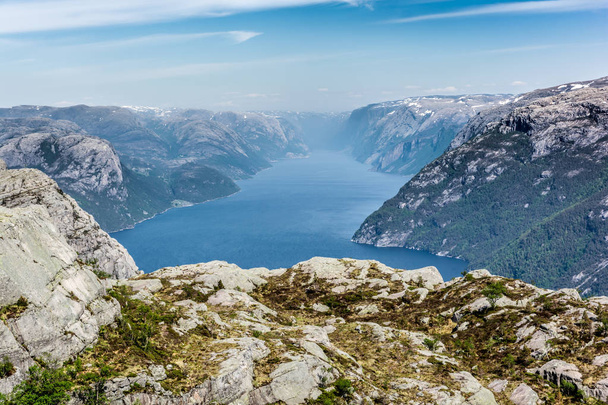 Preikestolen (Pulpit View of the Lysefjorden fjord. Made from the Preikestolen (Pulpit Rock) in Southern Norway on a sunny day. - 写真・画像