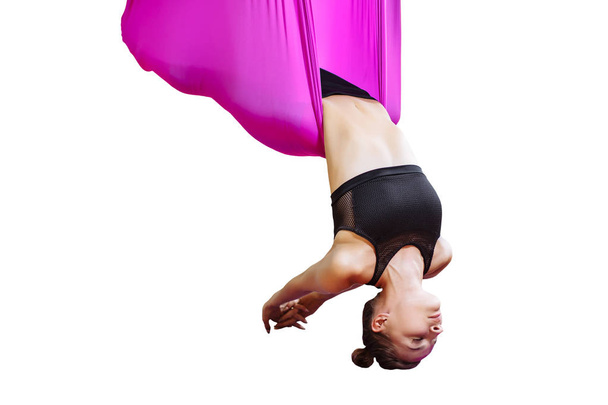 Young woman performing antigravity yoga exercise. - Photo, image