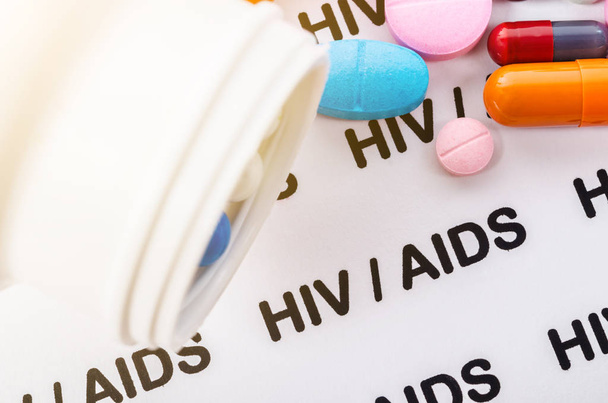 Pills on Hiv / aids paper background. - Foto, afbeelding