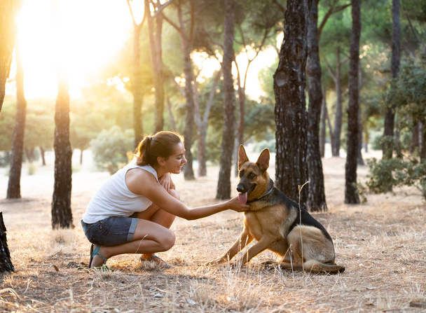 Woman teaching and loving her dog - Zdjęcie, obraz