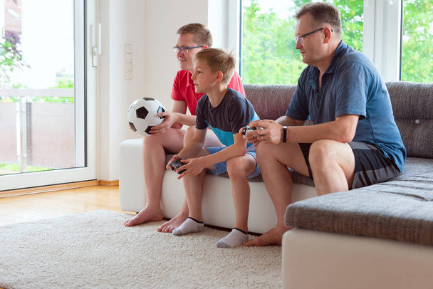 Grandparents, their son and grandson are watching world soccer championship and emotionally ill for the national team - Foto, Bild