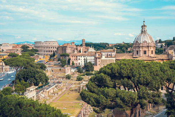 Aerial scenic view of Colosseum, Roman Forum in Rome and church of Santi Luca e Martina, Italy. - Photo, Image
