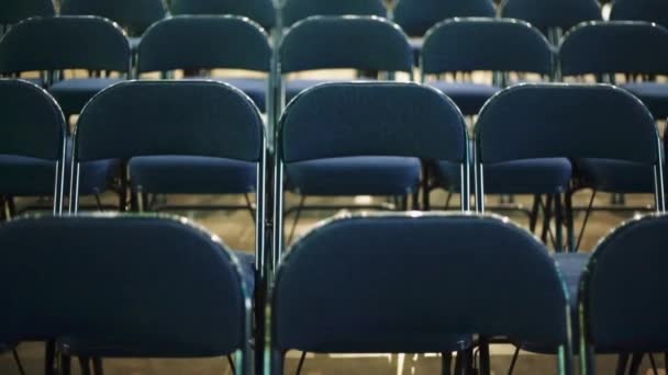 Tilt up of empty chairs at a venue before a concert - Footage, Video