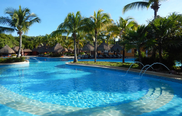 Generic tropical resort swimming pool in a Caribbean resort on the Riviera Maya, Mexico. - Photo, Image