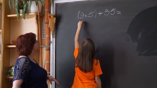 Young Student Writing Complex Mathematical Formula Equation on the Blackboard. - Video, Çekim