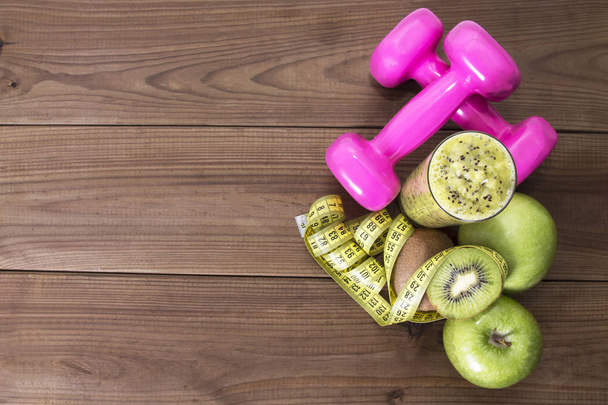 green juice, tape measure and dumbbells. diet and slimming concept - Φωτογραφία, εικόνα