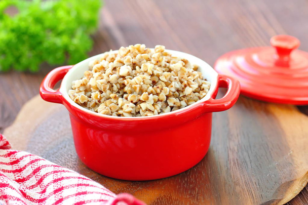 Buckwheat porridge in a pan. Healthy food - Photo, Image
