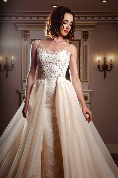Sensual brunette bride in luxury wedding dress over classic interior, fashion beauty portrait - Photo, Image