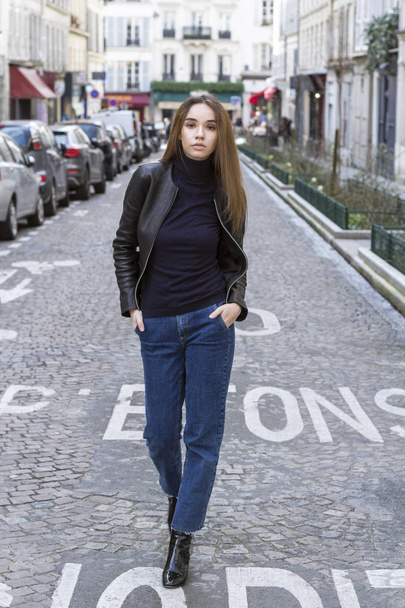 Street fashion concept. Portrait of elegant young beautiful woman. Paris buildings as background. - Фото, изображение