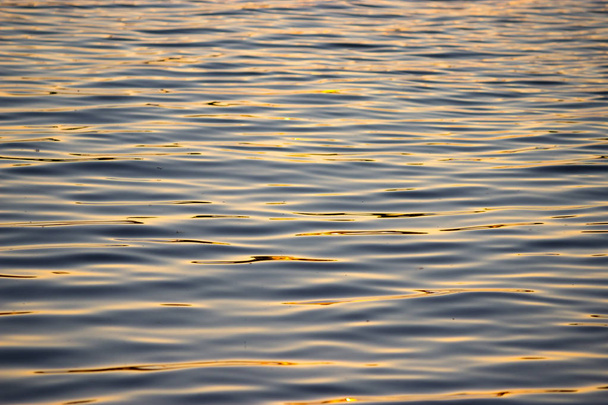 Isolated close-up of ripples on the surface of the river - Фото, изображение