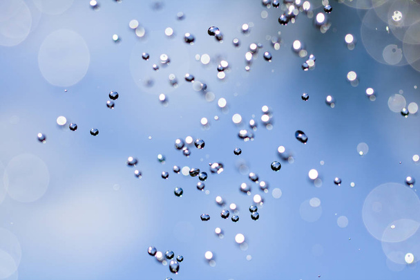 Close-up of water drops on glass surface as background. - Foto, Bild