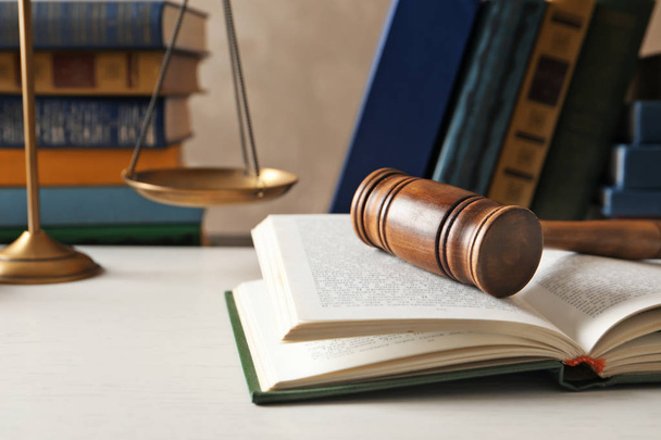 Wooden gavel, scales of justice and books on table. Law concept - Photo, Image