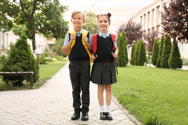 Little children in stylish school uniform outdoors - Zdjęcie, obraz
