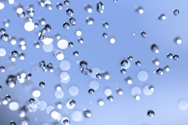 Close-up of water drops on glass surface as background. - Fotografie, Obrázek