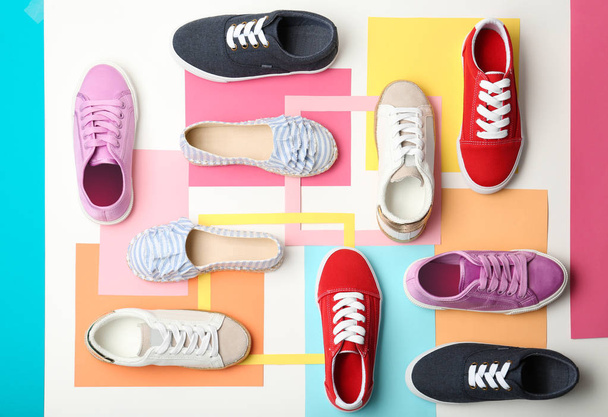 Flat lay composition with stylish new shoes on color background - Fotó, kép