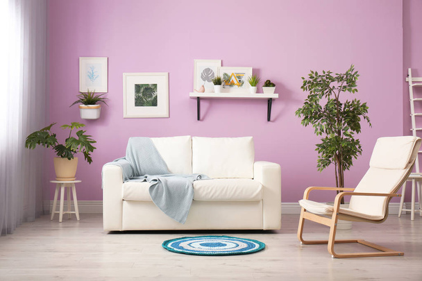 Stylish room interior with comfortable white sofa - Foto, immagini