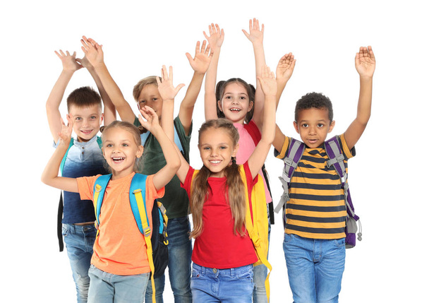 Group of little school children with backpacks on white background - Foto, Imagen