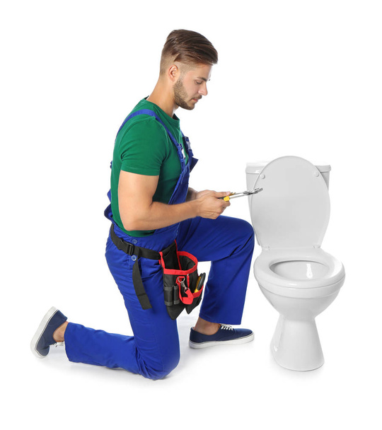 Young man working with toilet bowl, isolated on white - Foto, Imagem