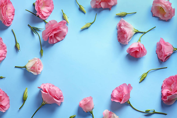 Flat lay composition with beautiful Eustoma flowers on color background - Foto, immagini
