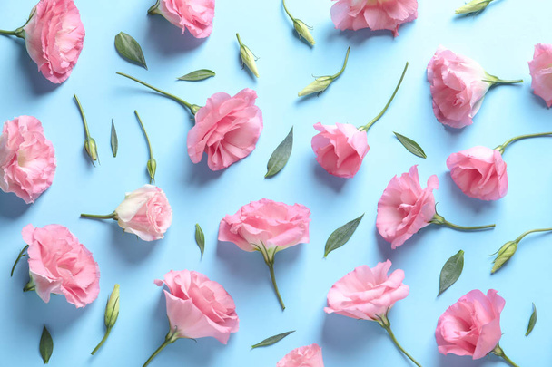 Flat lay composition with beautiful Eustoma flowers on color background - Foto, Imagem