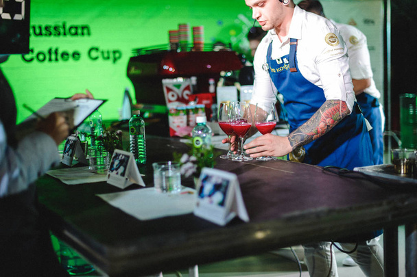 Russia, Novosibirsk - August 03, 2018: championship among coffee houses. members of teams show barista's skill, prepare drinks - Fotó, kép