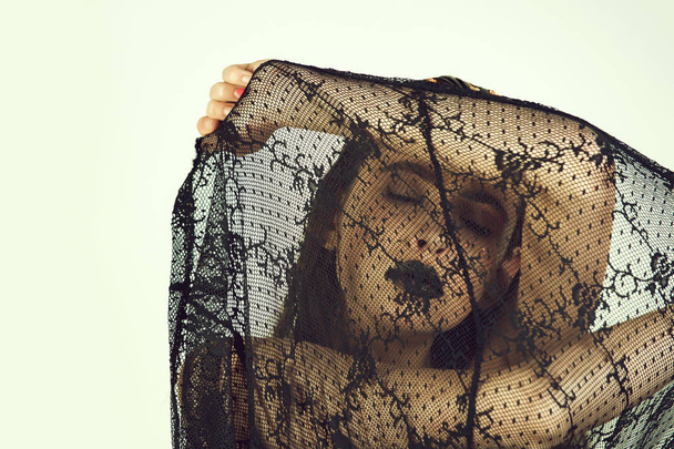 girl covering face with black, lace veil - Fotó, kép