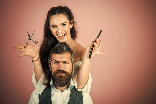 Woman with razor, scissors cut hair of man. - Fotoğraf, Görsel