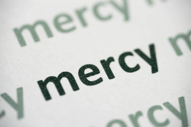 word mercy printed on white paper macro - Фото, изображение