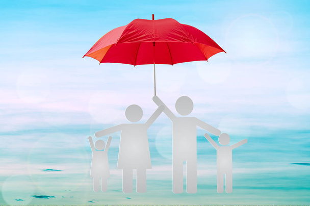 Life insurance concept, family to protection by umbrella. - Photo, Image