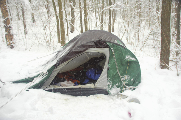 broken tent in the winter forest - Photo, Image