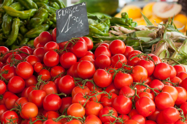 closeup of fresh tomatoes at the market - 写真・画像