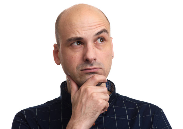 portrait of a bald man wondering isolated on white - Фото, зображення