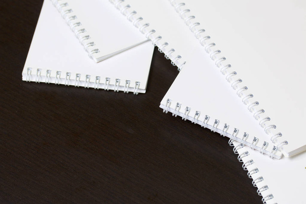 White spring notebooks for notes and sketches. Stationery for school and teaching. On a dark background. - Fotoğraf, Görsel