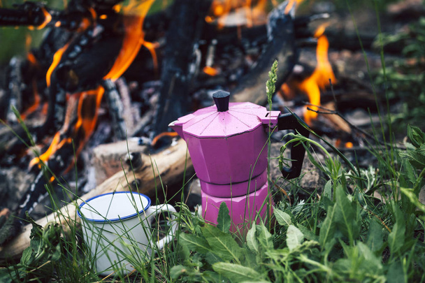 Mug and a geyser coffee maker. - Photo, Image