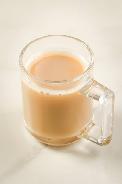cup of tea with milk/cup of tea with milk on a white background, selective focus  - Foto, immagini