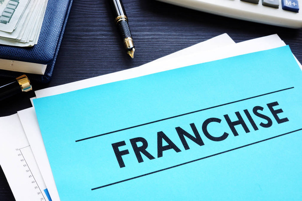 Documents with title franchise on a desk. - Photo, Image