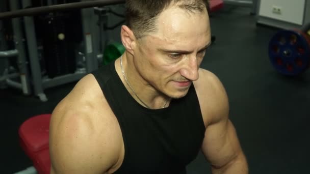 Tired muscular athlete after training - Video