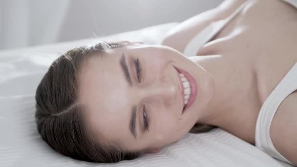 Face Care. Young Woman Lying On Bed And Touching Skin On Face - Metraje, vídeo