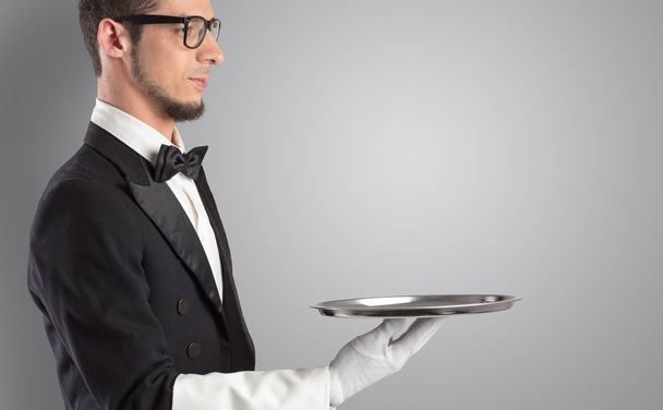 Waiter serving with white gloves and steel tray - Φωτογραφία, εικόνα