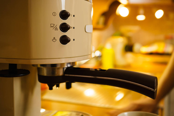 Detailed closeup of coffee maker machine in kitchen. Barista objects, homemade hot drinks concept. - Foto, immagini