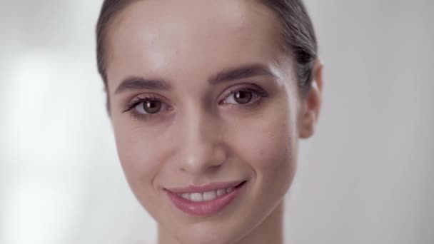 Womans Face Care. Smiling Female Touching Skin On Face  - Πλάνα, βίντεο