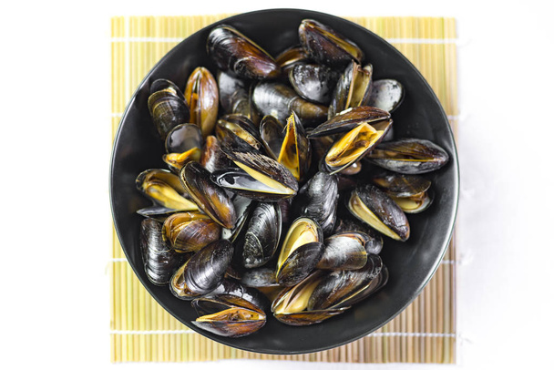 Delicious seafood steamed mussels on a plate - Photo, Image