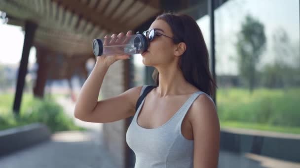 Attractive woman drinking water - Filmmaterial, Video